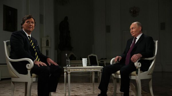 Russian President Vladimir Putin and US journalist Tucker Carlson are seen during an interview at the Kremlin in Moscow, Russia. - Sputnik Việt Nam