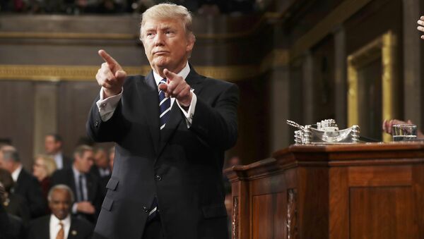 U.S. President Donald Trump reacts after delivering his first address to a joint session of Congress from the floor of the House of Representatives iin Washington, U.S., February 28, 2017 - Sputnik Việt Nam