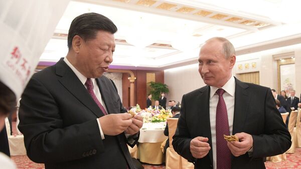 Tổng thống Nga Vladimir Putin đã làm trong chuyến thăm Trung Quốc tại thành phố Thiên Tân - Sputnik Việt Nam