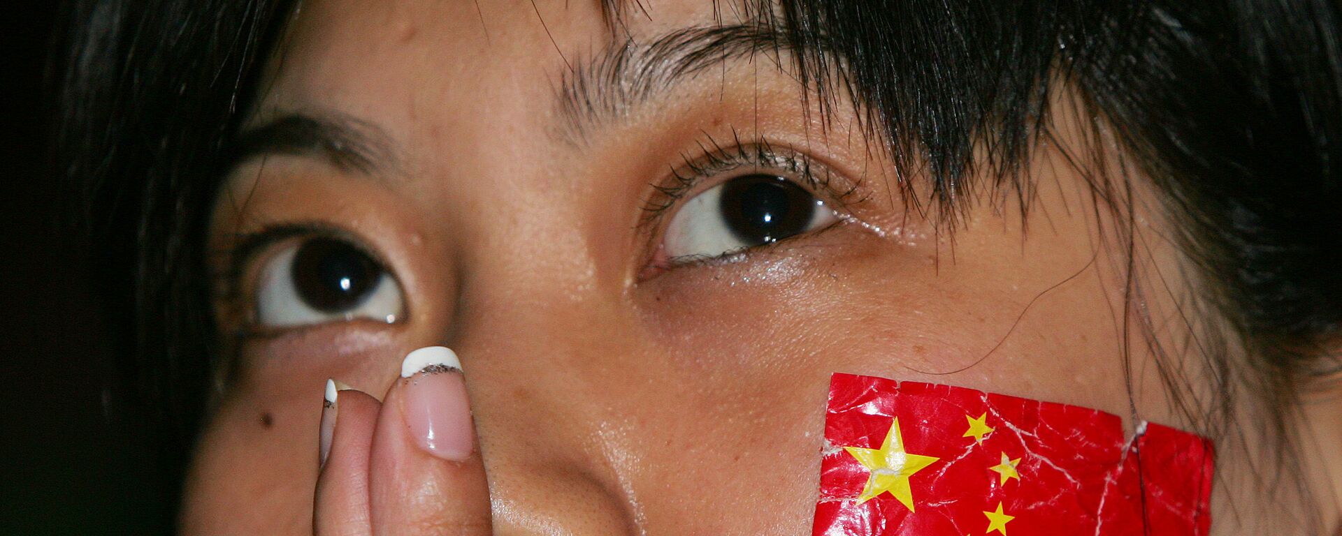 Cô gái với lá cờ Trung Quốc trên má. - Sputnik Việt Nam, 1920, 29.06.2020